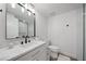 Clean bathroom featuring modern sink, toilet, and glass-enclosed shower at 326 Randolph Rd, Venice, FL 34293