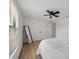 Bedroom featuring a fan, closet, and neutral tones for relaxation at 326 Randolph Rd, Venice, FL 34293