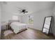 Airy bedroom with white walls and wood floors, bathed in natural light at 326 Randolph Rd, Venice, FL 34293