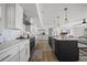 Stylish kitchen featuring modern appliances, countertops, an island with bar seating, and wood look floors at 326 Randolph Rd, Venice, FL 34293