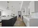 Modern kitchen featuring a large island, white cabinets, and stainless steel appliances at 326 Randolph Rd, Venice, FL 34293
