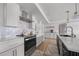 Stylish kitchen with an island, stainless steel appliances, and light-colored tile backsplash at 326 Randolph Rd, Venice, FL 34293