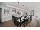 Beautiful kitchen with an island and bar seating, modern countertops and stylish pendant lighting at 326 Randolph Rd, Venice, FL 34293