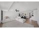 Bright, open-concept living room featuring modern decor, neutral color palette and wood flooring at 326 Randolph Rd, Venice, FL 34293