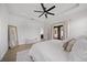 Spacious main bedroom with a ceiling fan and access to the outdoor living space at 326 Randolph Rd, Venice, FL 34293