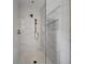 Modern shower with elegant tile work and bronze fixtures at 326 Randolph Rd, Venice, FL 34293