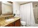 Bathroom with a granite-look counter, mirror, and white shower curtain at 3985 Maceachen Blvd # 224, Sarasota, FL 34233