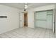 A simple bedroom with a closet and white tile floors shows the empty space available at 3985 Maceachen Blvd # 224, Sarasota, FL 34233
