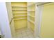 Walk in closet with multiple shelves and a rod for hanging clothes at 3985 Maceachen Blvd # 224, Sarasota, FL 34233