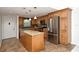 Beautiful kitchen with stainless steel appliances, granite countertops, and a center island at 3985 Maceachen Blvd # 224, Sarasota, FL 34233