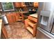 Kitchen details include stainless appliances, granite counters, convenient pull-out shelving, and tile floors at 3985 Maceachen Blvd # 224, Sarasota, FL 34233