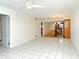 Open concept living area showcasing tile floors and seamless flow into the kitchen, perfect for entertaining at 3985 Maceachen Blvd # 224, Sarasota, FL 34233