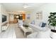 Bright living room with tile floors, modern furnishings, and an open floor plan at 3985 Maceachen Blvd # 224, Sarasota, FL 34233