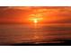A breathtaking sunset over the ocean, featuring vibrant colors and serene waves in Siesta Key at 3985 Maceachen Blvd # 224, Sarasota, FL 34233