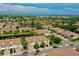 Expansive aerial view of a community with lush landscaping, serene lakes, and beautiful homes in a desirable area at 4026 Overture Cir # 487, Bradenton, FL 34209