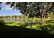Scenic view of a well-maintained backyard and tranquil lake, providing a serene and picturesque setting at 4026 Overture Cir # 487, Bradenton, FL 34209