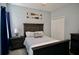 Cozy bedroom with a rustic wooden bed frame, nautical decor, and a spacious closet at 4026 Overture Cir # 487, Bradenton, FL 34209