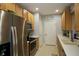 Well-appointed kitchen with stainless steel appliances, wood cabinetry, and ample counter space at 4026 Overture Cir # 487, Bradenton, FL 34209