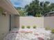 Backyard features white rock ground cover and minimalist bushes at 4154 Center Pointe Cir # 57A, Sarasota, FL 34233