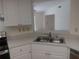 Bright kitchen with white cabinets, updated countertop, and stainless steel appliances at 4154 Center Pointe Cir # 57A, Sarasota, FL 34233