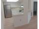Bright kitchen features stainless steel refrigerator, white cabinets and light countertops at 4154 Center Pointe Cir # 57A, Sarasota, FL 34233