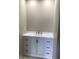 Modern bathroom vanity with white countertop and cabinets at 5178 Lake Village Drive # 86, Sarasota, FL 34235