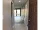 Inviting entryway leading to a well-lit living space and the view of the screened lanai at 5178 Lake Village Drive # 86, Sarasota, FL 34235