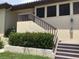 Exterior view of the condo featuring well-maintained landscaping and private entrance at 5178 Lake Village Drive # 86, Sarasota, FL 34235