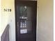 Inviting front door with glass panel and visible address number at 5178 Lake Village Drive # 86, Sarasota, FL 34235