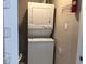 Stackable washer and dryer unit in a functional laundry area at 5178 Lake Village Drive # 86, Sarasota, FL 34235