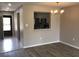 Living room with view to the kitchen featuring stainless steel appliances and ample natural light at 5178 Lake Village Drive # 86, Sarasota, FL 34235