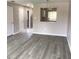Open living room with views of the kitchen and neutral wall colors at 5178 Lake Village Drive # 86, Sarasota, FL 34235