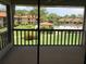 Relaxing screened lanai with views of the pool and surrounding landscaped grounds at 5178 Lake Village Drive # 86, Sarasota, FL 34235