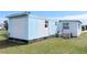View of the back of the home, showing the exterior paint and air conditioning at 5233 Kenwood Ave, Sarasota, FL 34234