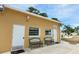Exterior view of the community laundromat with benches, windows, and adjacent parking at 5233 Kenwood Ave, Sarasota, FL 34234
