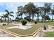 A well-kept outdoor mini golf area with mature trees, perfect for friendly competition at 5233 Kenwood Ave, Sarasota, FL 34234