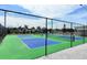A well-maintained pickleball court for recreational activities with green and blue surface at 5233 Kenwood Ave, Sarasota, FL 34234