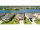 Single-Gathering home features a well-manicured lawn and a picturesque waterfront view at 5327 Olano St, Palmetto, FL 34221