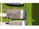 Aerial view of a private backyard with a screened-in patio and beautiful pond views at 5327 Olano St, Palmetto, FL 34221