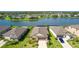 Beautiful home with a large lake, well-manicured lawn, and lush greenery around the community at 5327 Olano St, Palmetto, FL 34221