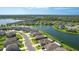 Single-Gathering home with a manicured lawn and picturesque waterfront views of the community at 5327 Olano St, Palmetto, FL 34221