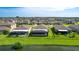 Backyard view with a screen enclosed patio and fence with a lake view at 5327 Olano St, Palmetto, FL 34221