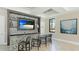 Entertain in style with this in-home bar, complete with sleek countertops and a modern backsplash design at 5327 Olano St, Palmetto, FL 34221