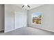 Bedroom featuring a window with a street view and a closet with double doors at 5327 Olano St, Palmetto, FL 34221