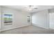 A light, bright bedroom with two windows overlooking the backyard lake, plus a ceiling fan at 5327 Olano St, Palmetto, FL 34221
