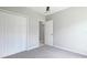 Bedroom with neutral walls, carpet flooring, ceiling fan, and a closet at 5327 Olano St, Palmetto, FL 34221