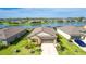 Beautiful single-Gathering home featuring a well-manicured lawn and a stunning lake view at 5327 Olano St, Palmetto, FL 34221