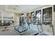 Bright community fitness center equipped with modern cardio machines, weights, and large windows overlooking the pool area at 5327 Olano St, Palmetto, FL 34221