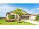 Charming single-story home with a well-manicured lawn, landscaping and a two car garage at 5327 Olano St, Palmetto, FL 34221