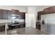 Kitchen featuring granite countertops, stainless steel appliances, and a pantry with wire shelving at 5327 Olano St, Palmetto, FL 34221